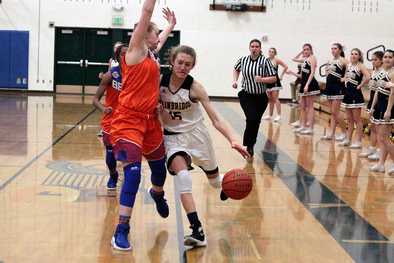 Luciano Marano | Bainbridge Island Review                                Spartan senior Kiera Havill makes a grab for a rebound during Wednesday’s game against Nathan Hale.