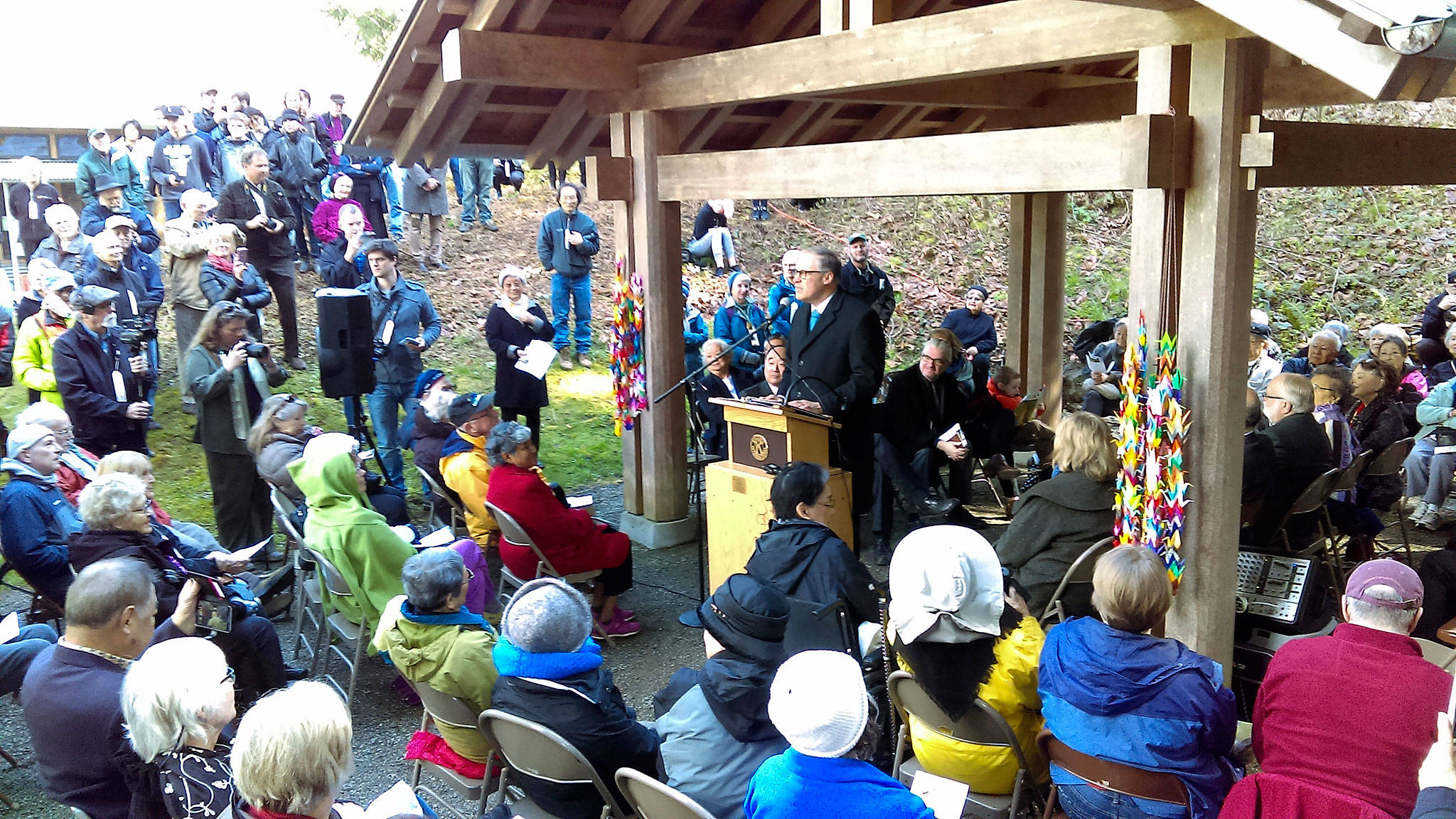Luciano Marano | Bainbridge Island Review - Washington Governor Jay Inslee speaks to the gathered crowd at the recent 75th annual internment commemoration ceremony at the Bainbridge Island Japanese American Exclusion Memorial.