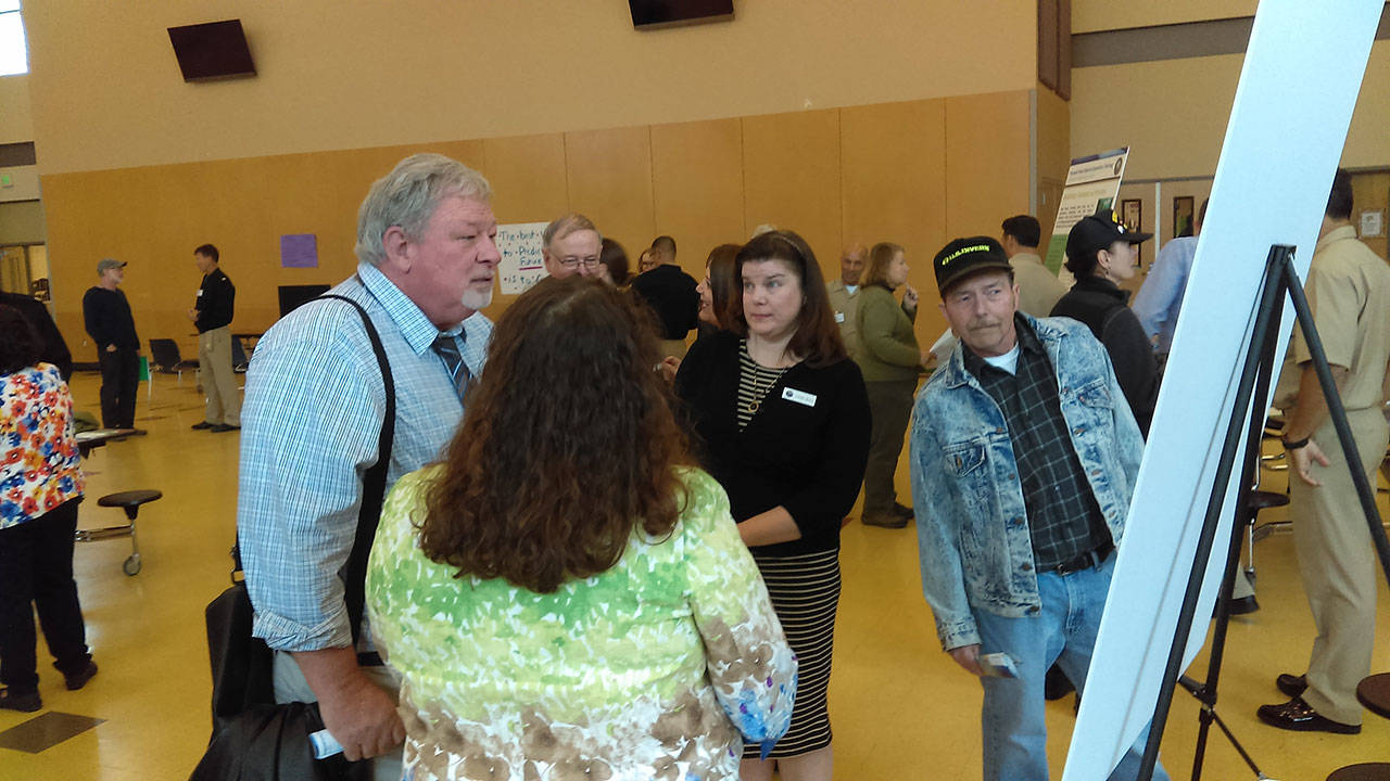 Luciano Marano | Bainbridge Island Review - Kitsap residents gathered Tuesday evening at North Kitsap High School for an informational open house hosted by U.S. Navy personnel regarding a proposal to conduct special warfare training in various local shoreline locations.