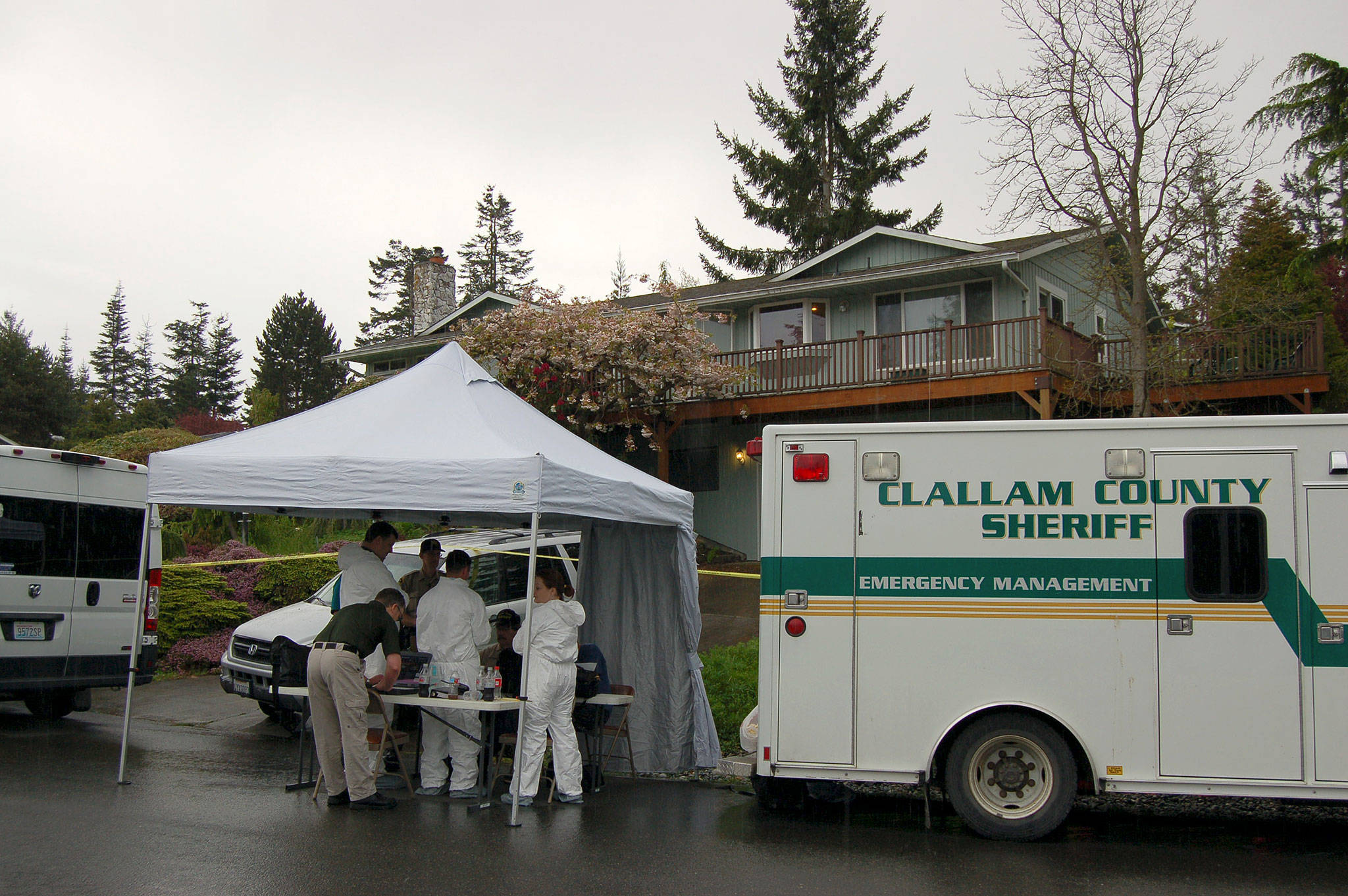 Representatives with the Clallam County Sheriff’s Office and Coroner’s Office investigate a homicide on the 100 block of Hurricane Drive in Sunland on Thursday, May 4. Sequim Gazette photo by Matthew Nash