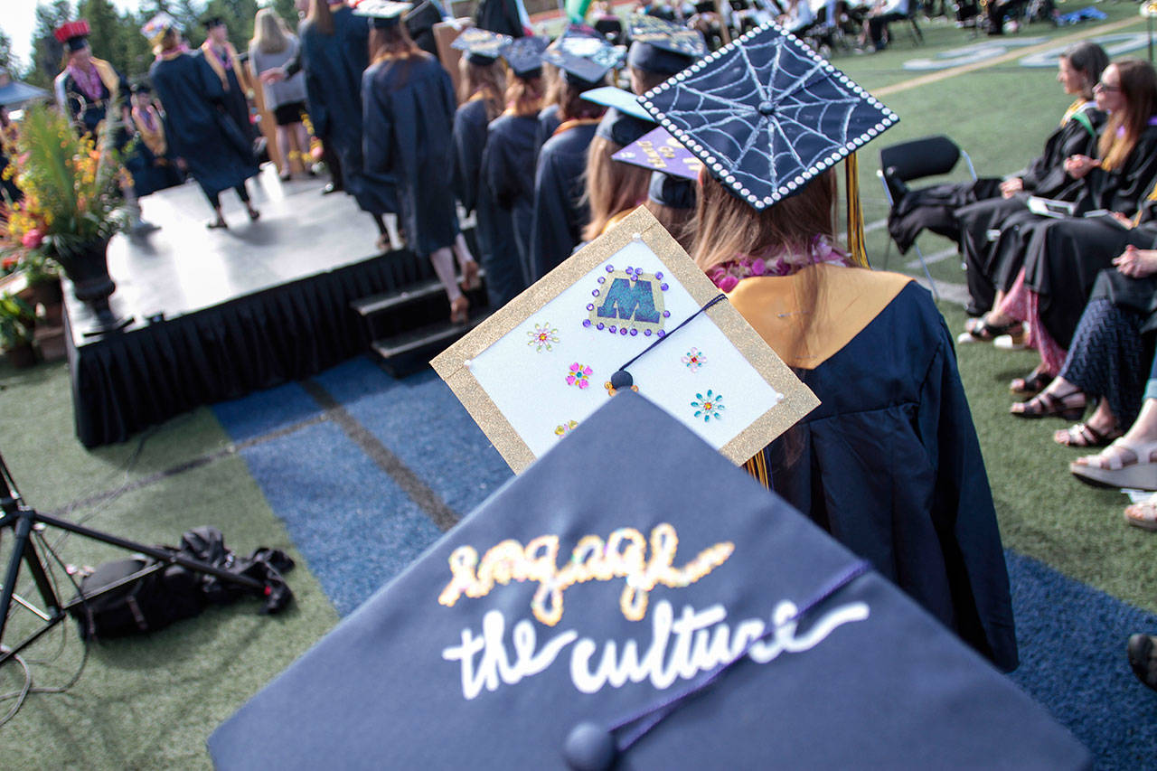 Luciano Marano | Bainbridge Island Review - Many seniors decorated their caps with ethos and advice, like this one: “Engage the culture.”
