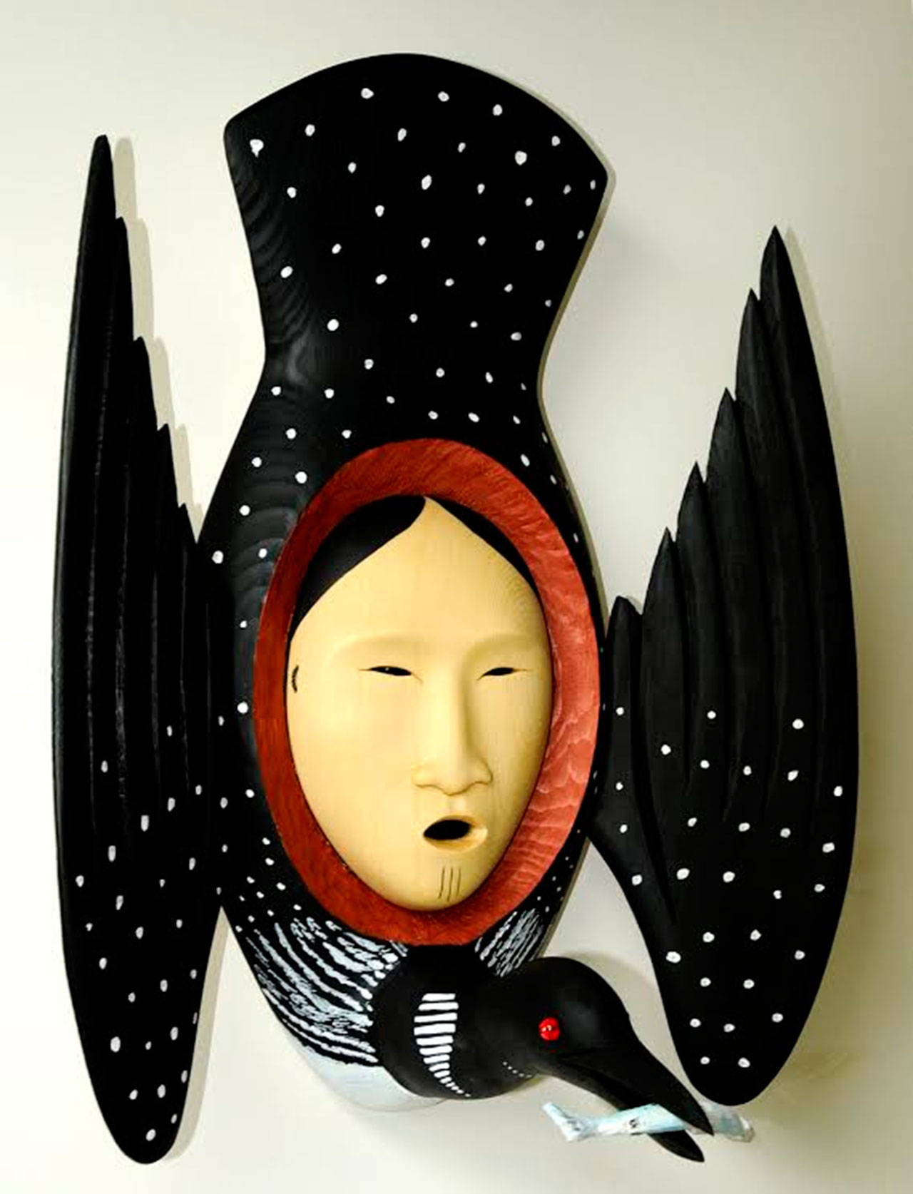 Photo courtesy of Roby King Galleries                                Suquamish artist Larry “Ulaaq” Ahvakana’s “Female Loon Spirit Mask.” Red and yellow cedar, acrylic, glass beads.