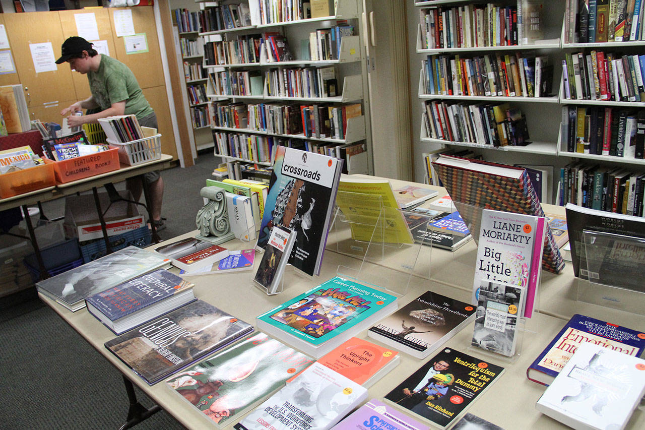 A shopper looks for bargains at a recent book sale at the Bainbridge Public Library. Brian Kelly | The Bainbridge Review