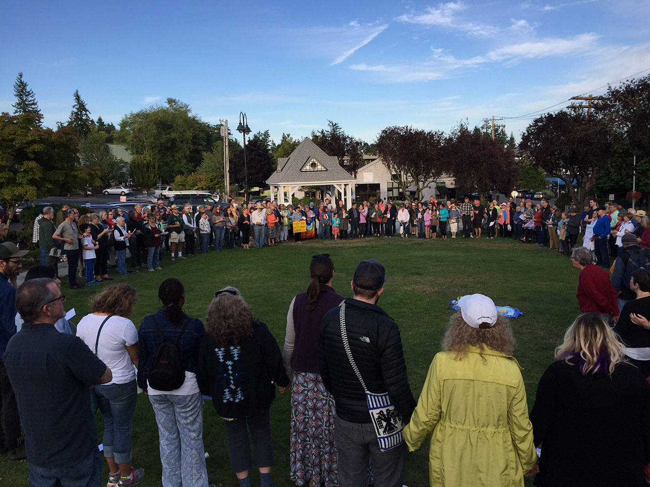 Nick Twietmeyer | The Bainbridge Island Review                                A crowd of more than 250 people gathered at Winslow Green to remember Heather Heyer, who was killed on Saturday when a white nationalist supporter drove his car into a crowd of counter-protesters.