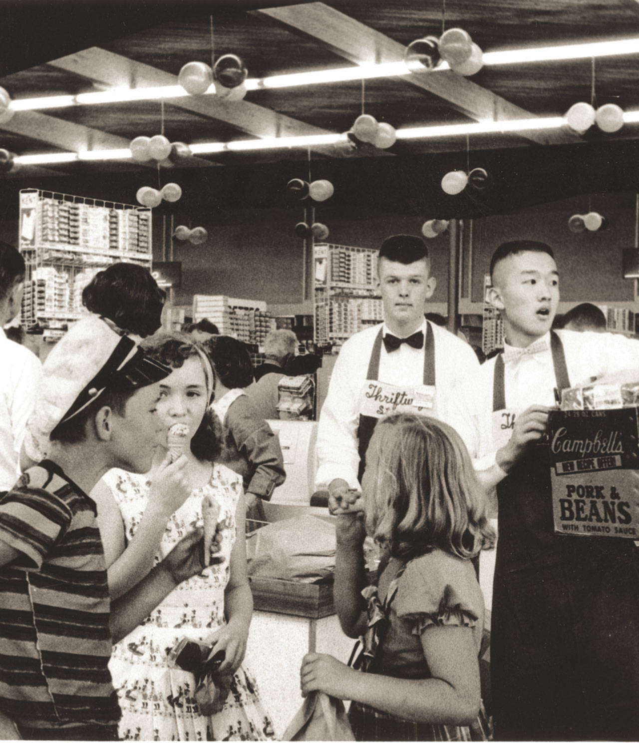 Photo courtesy of Becky Fox Marshall | A scene from the grand opening of Town & Country Market in 1957. The company will celebrate 60 years of service with a community party from 11 a.m. to 2 p.m. Saturday, Aug. 26, at the downtown Winslow market where it all began.