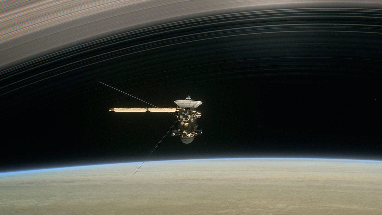 Image courtesy of NASA - Artist’s concept of Cassini diving between Saturn and its innermost ring.