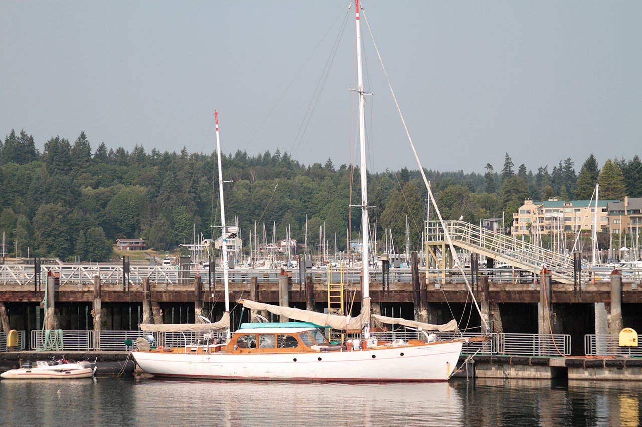 Luciano Marano | Bainbridge Island Review - The Flying Gull, the sailboat from which a gunman fired more than 100 roads from a rifle at the area surrounding Eagle Harbor before being eventually himself shot and killed by police, sits moored at the Washington State Ferries Eagle Harbor Maintenance Facility. The boat is now for sale via an online state auction.