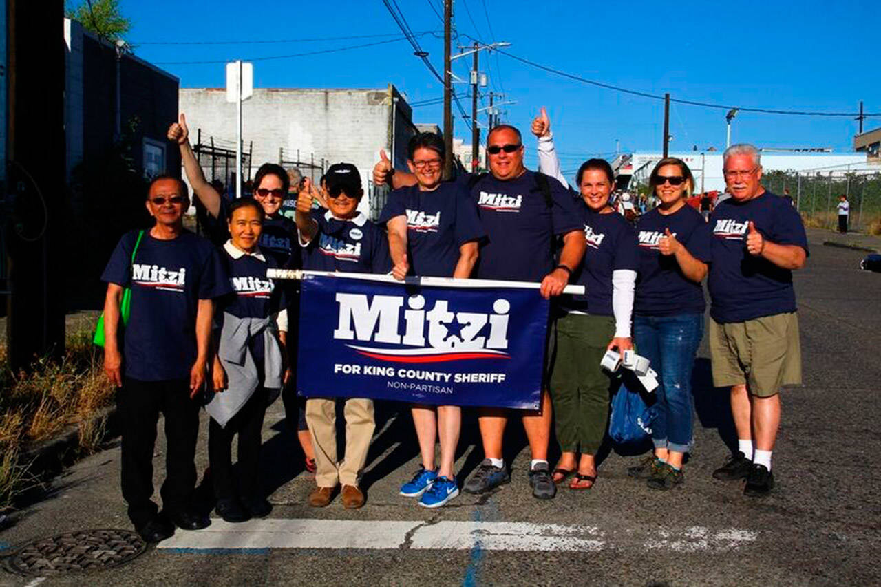 Photo courtesy of Mitzi Johanknecht for King County Sheriff | Mitzi Johanknecht with supporters at a recent Seattle Seafair parade.