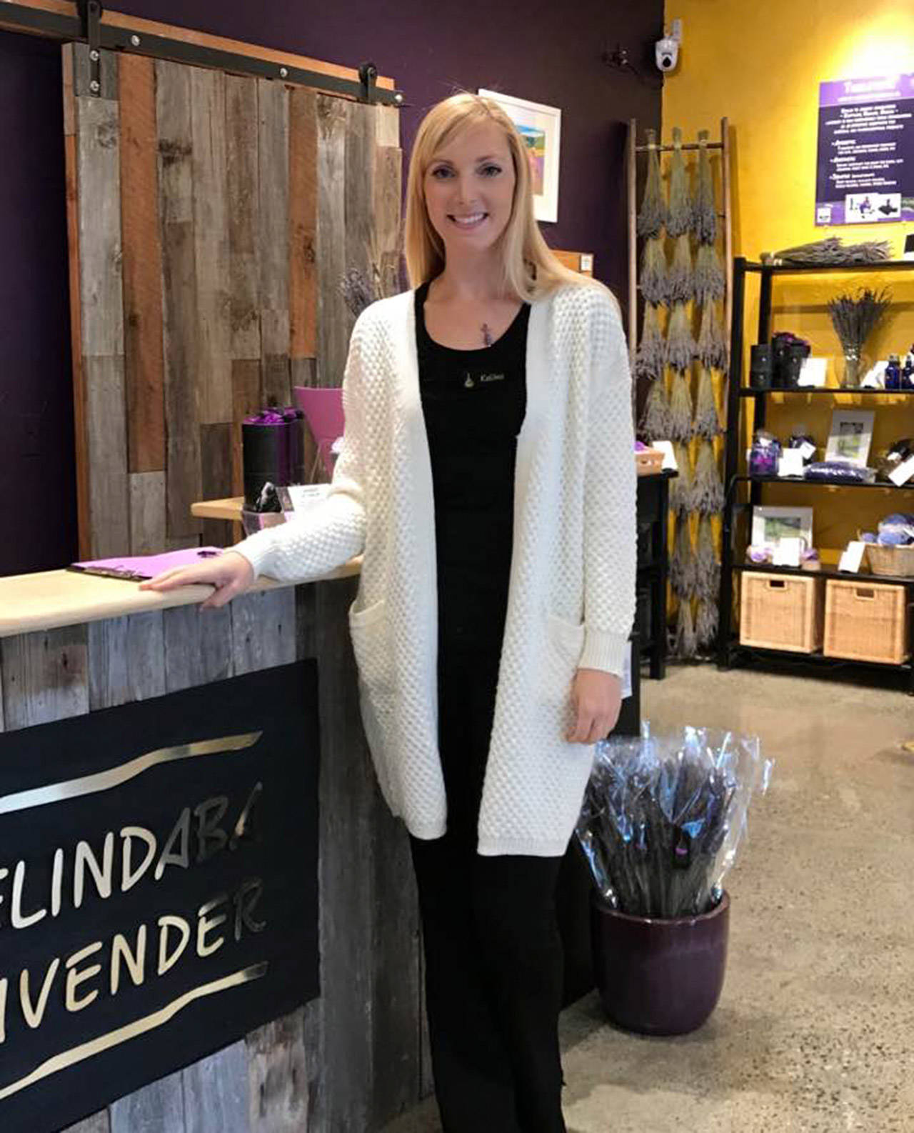 Kalina Jazuk stands at the customer counter inside the new location of Pelindaba Lavender.