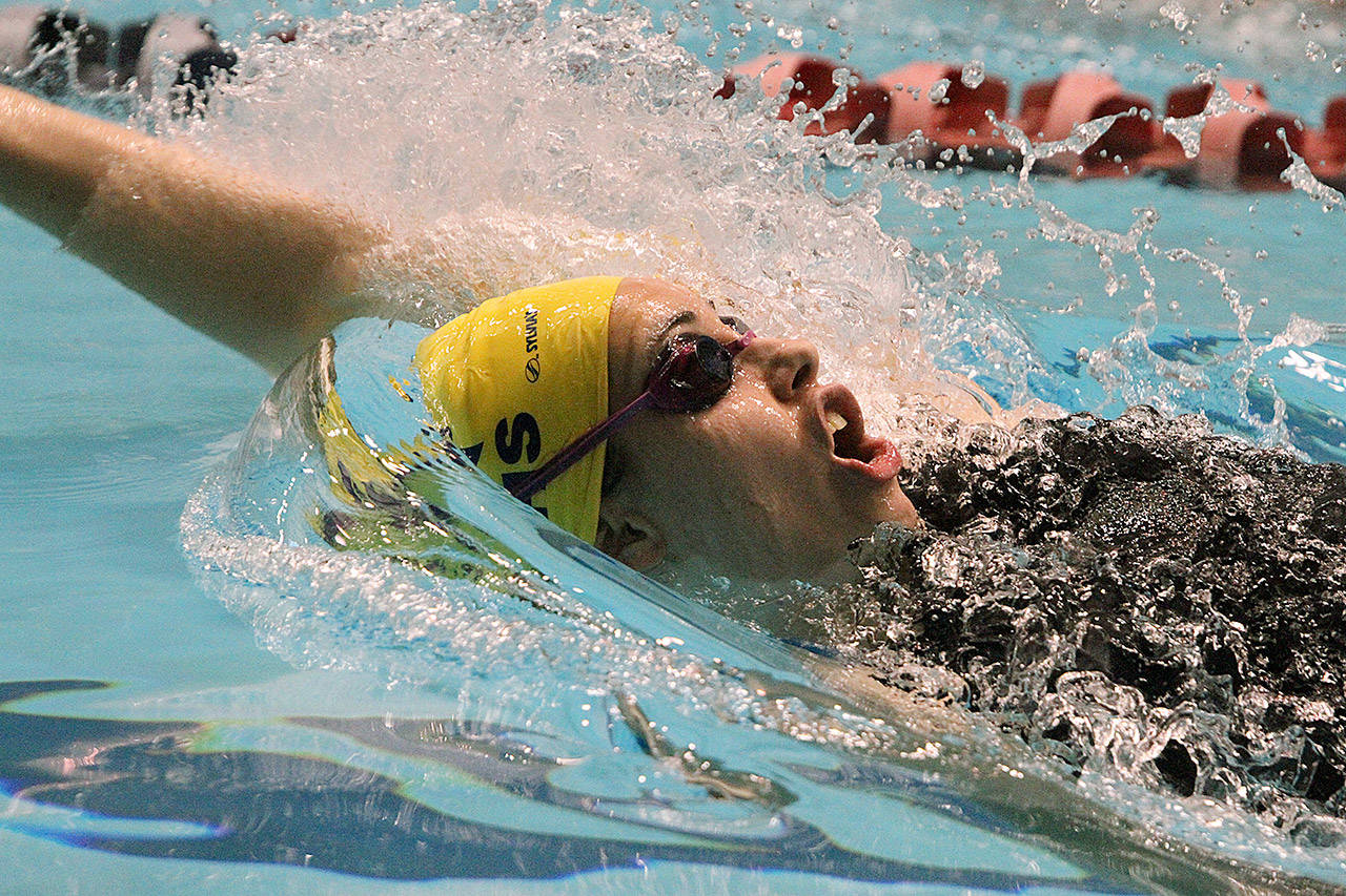 The Spartans’ Moorea Eldon-Everts swims in the 100-yard backstroke at the state swimming championships in Federal Way.                                (Brian Kelly | Bainbridge Island Review)
