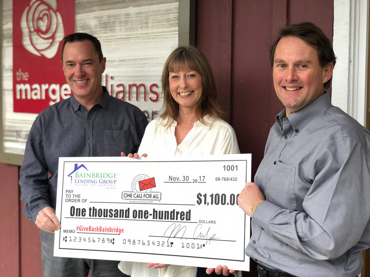 Matt Culp (right) along with fellow mortgage broker Tom Rees (left) presents Bainbridge Lending Group’s first quarterly check to support 9 local nonprofits as part of its #GiveBackBainbridge client-designated donation program to Tracey Peacoe Denlinger, executive director of One Call for All. (Photo courtesy of Bainbridge Lending Group)