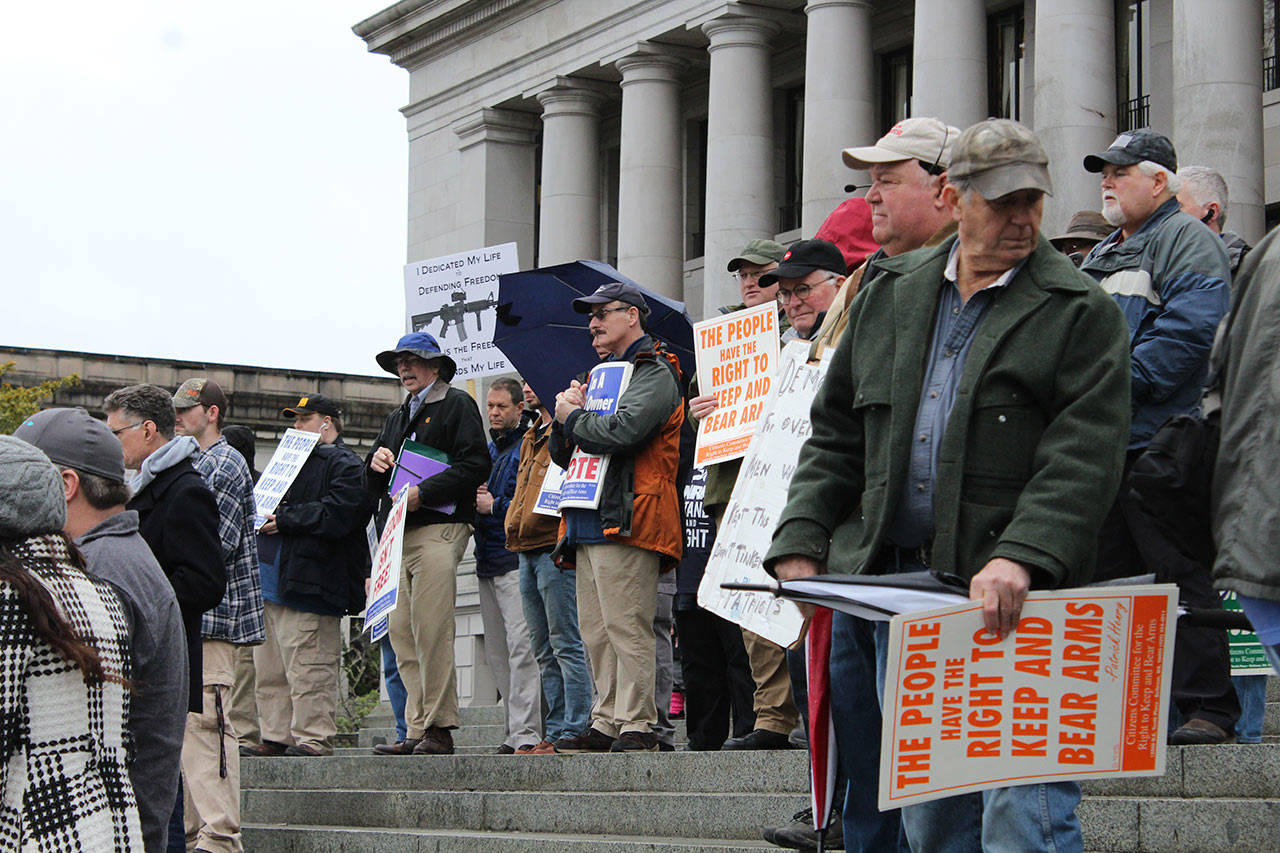 Gun rights supporters gathered on the steps of the Capitol building for a rally in Olympia on Friday. (Taylor McAvoy | WNPA Olympia News Bureau)