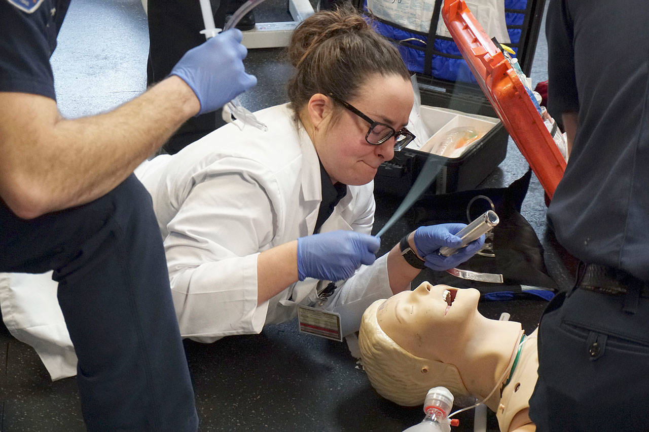 Luciano Marano | Bainbridge Island Review - A student of Washington’s Medic One paramedic training program attempts an intubation during last week’s “Mega Code” drill session.