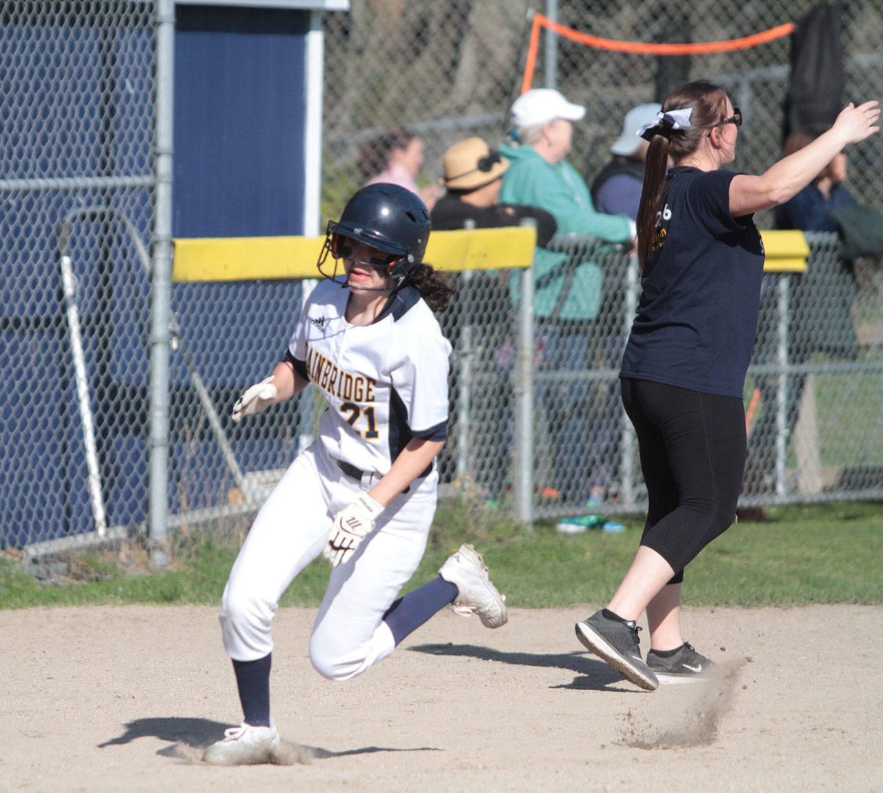 Morgan Lassoff rounds third on her way home for Bainbridge’s first score of the game against Gig Harbor. (Brian Kelly | Bainbridge Island Review)