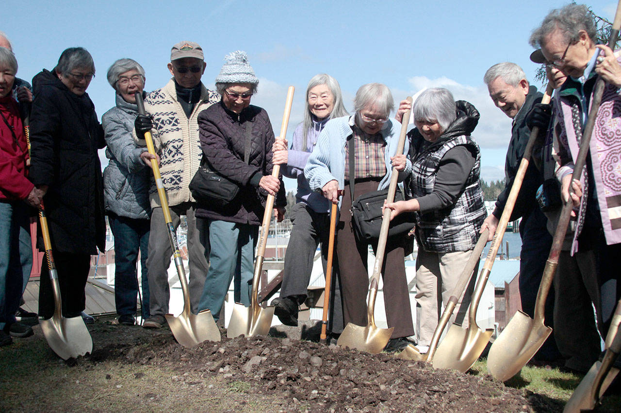 Luciano Marano | Bainbridge Island Review - Internment survivors dug the first shovels full of dirt at the groundbreaking of the Exclusion Departure Deck, an additional feature currently being constructed at the Bainbridge Island Japanese American Exclusion Memorial, at the close of the 76th anniversary commemoration ceremony of the forced exclusion Monday, March 30.
