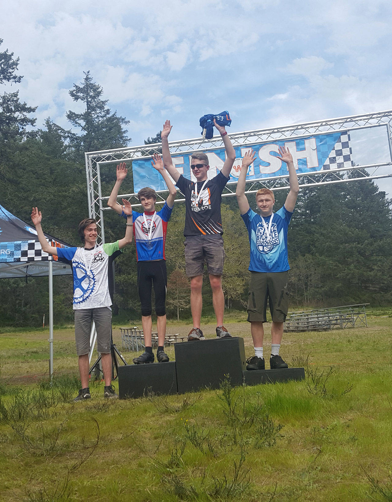 High school team rider Ezra Twieten (far left) of the Gear Grinders joins the other medalists on the winners’ platform.