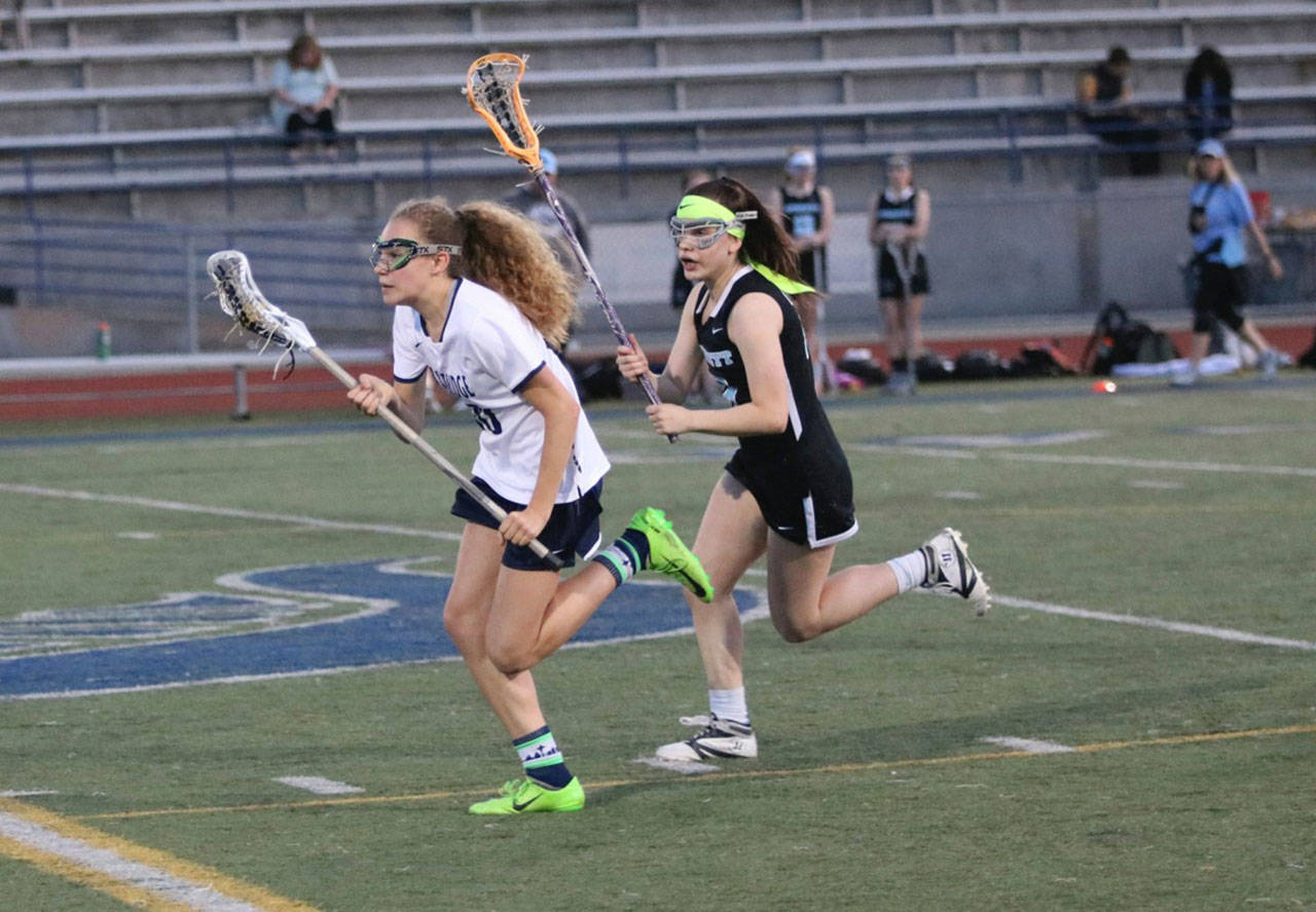 Elli Prickett charges upfield in the Spartans win against Everett. (Lara Sweeney photo)