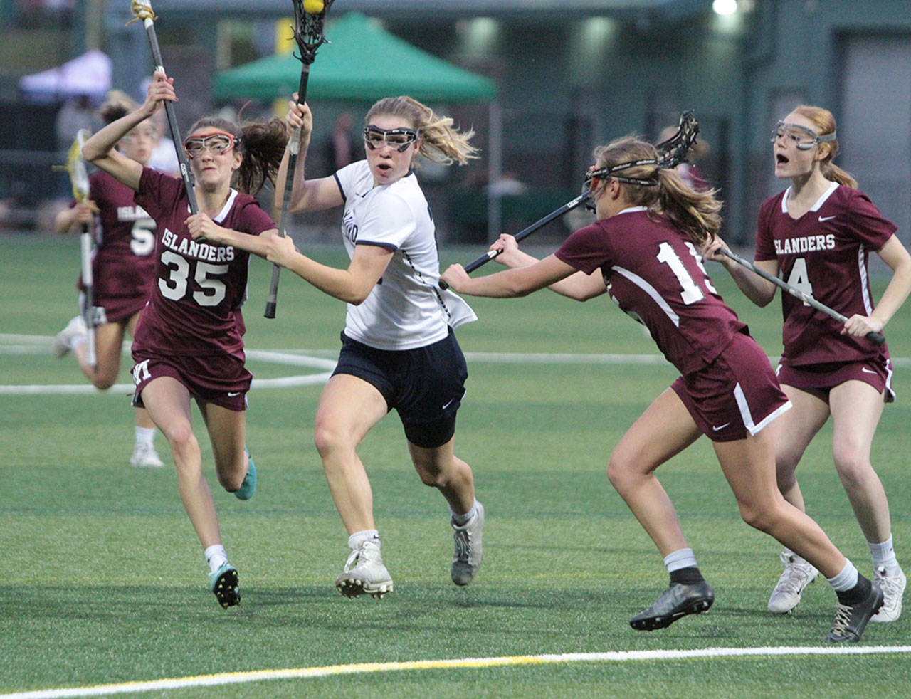 Mackenzie Chapman attacks the Mercer Island goal during first-half action in the Washington state girls lacrosse championship game. (Brian Kelly | Bainbridge Island Review)