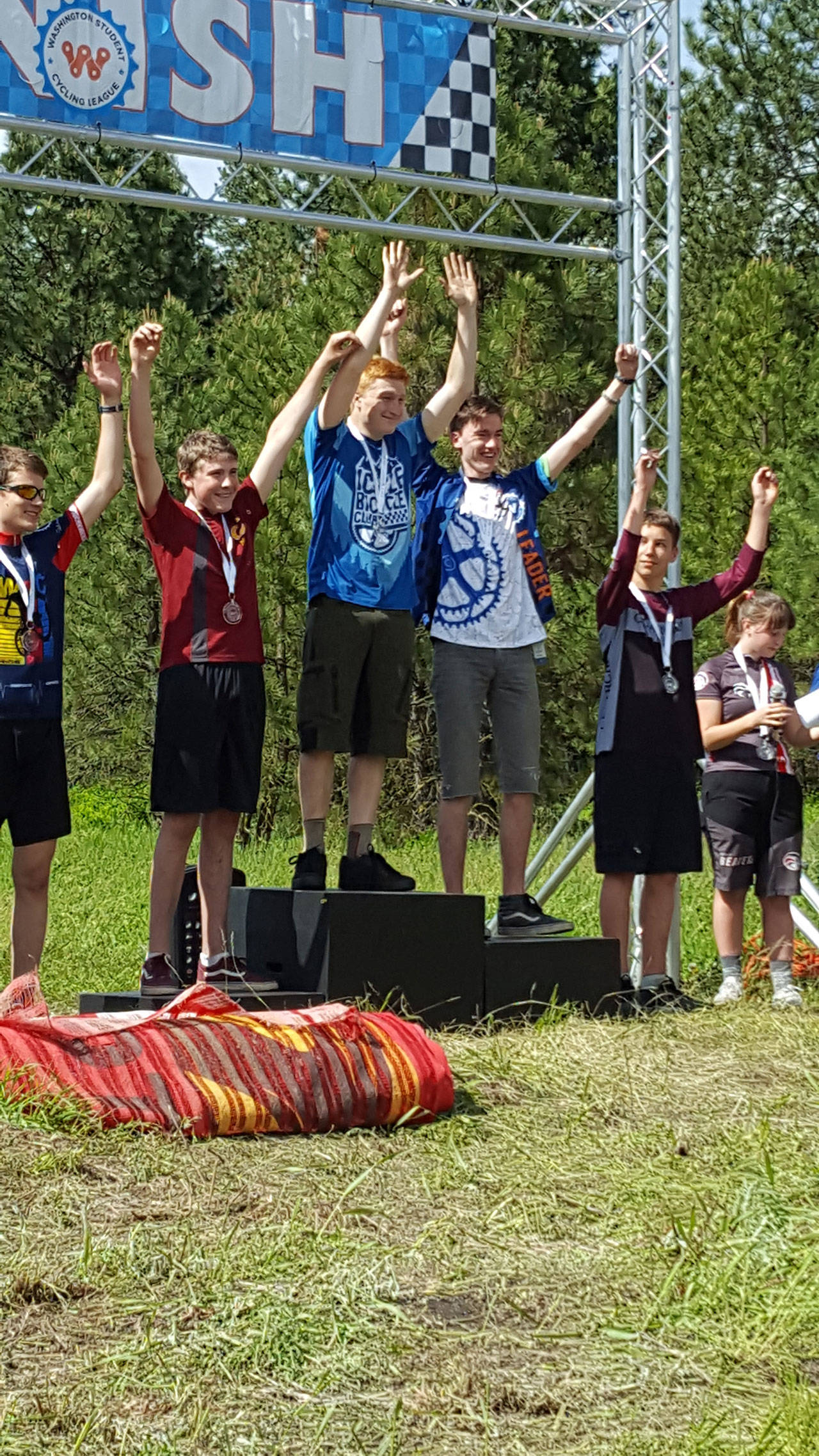 Photo courtesy of Jo Vanderlee | Ezra Tweiten stands on the podium after winning second place in the Beginner High School Boys race.