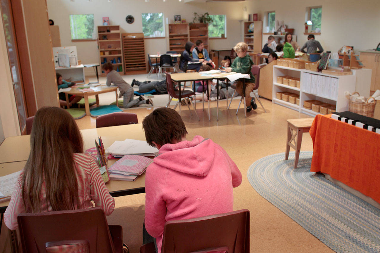 Luciano Marano | Bainbridge Island Review - Students complete assignments in one of the newly constructed buildings at the unified Arrow Point Drive campus of the Montessori Country School.