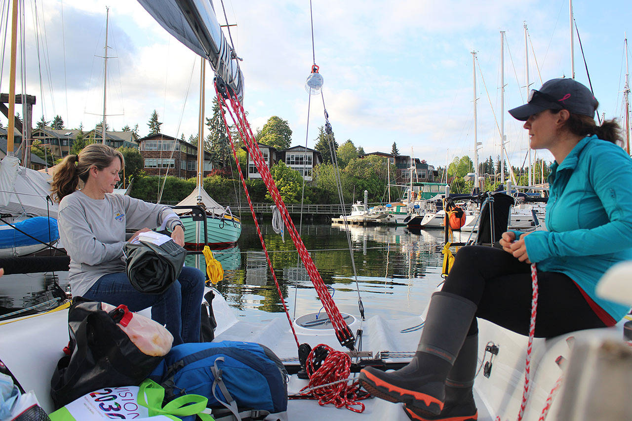 Haley Lhamon (left) and Anna Stevens (right) prepare the team’s boat for their next sailing practice on Thursday, May 21. Lhamon is one of two skippers on the crew and just received her power boat captain certification. “Just in time to take the motor out,” said crew member Allison Dvaladze.