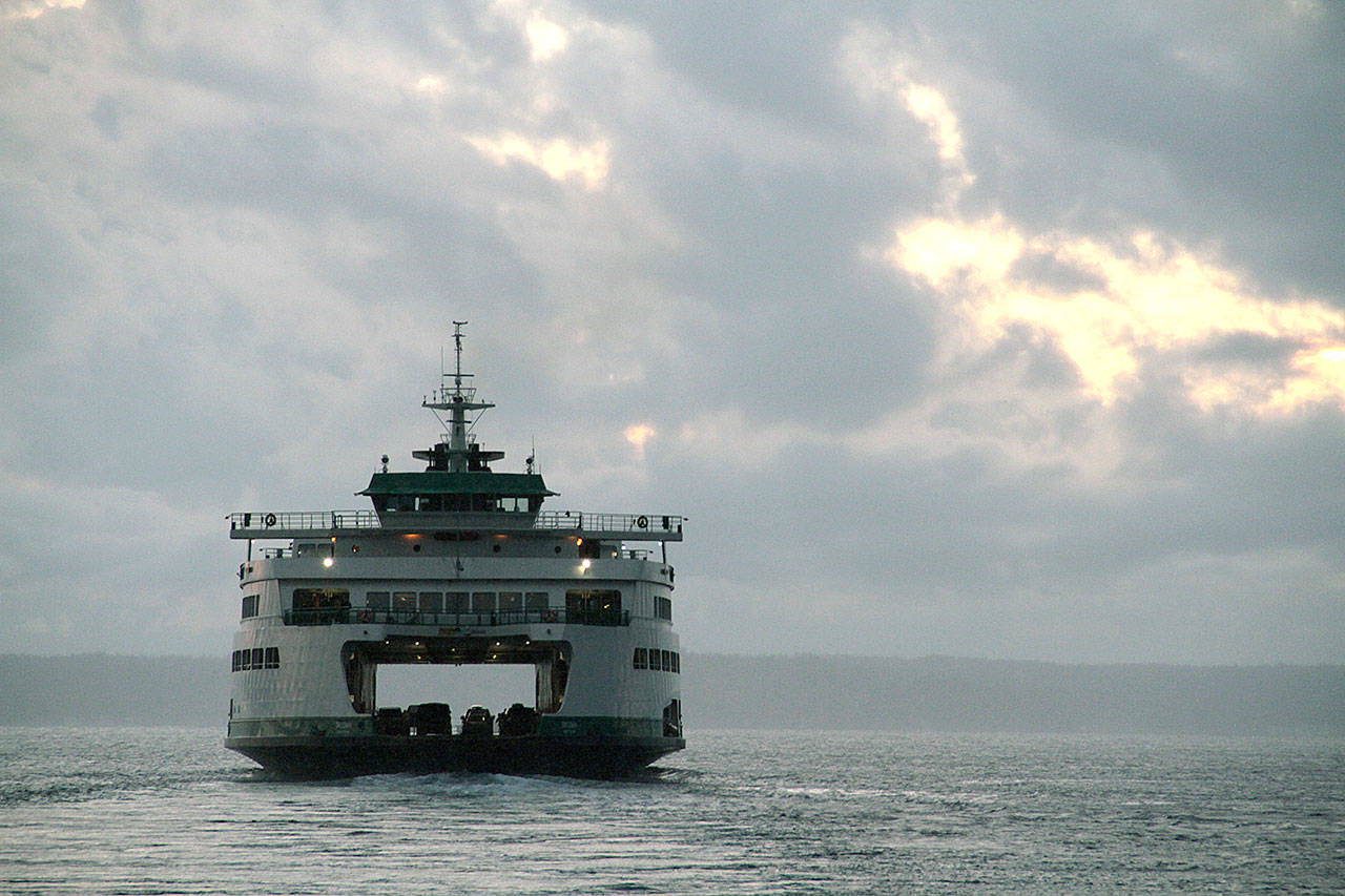 The Bainbridge ferry departs Colman Dock for the island. (Brian Kelly | Bainbridge Island Review)