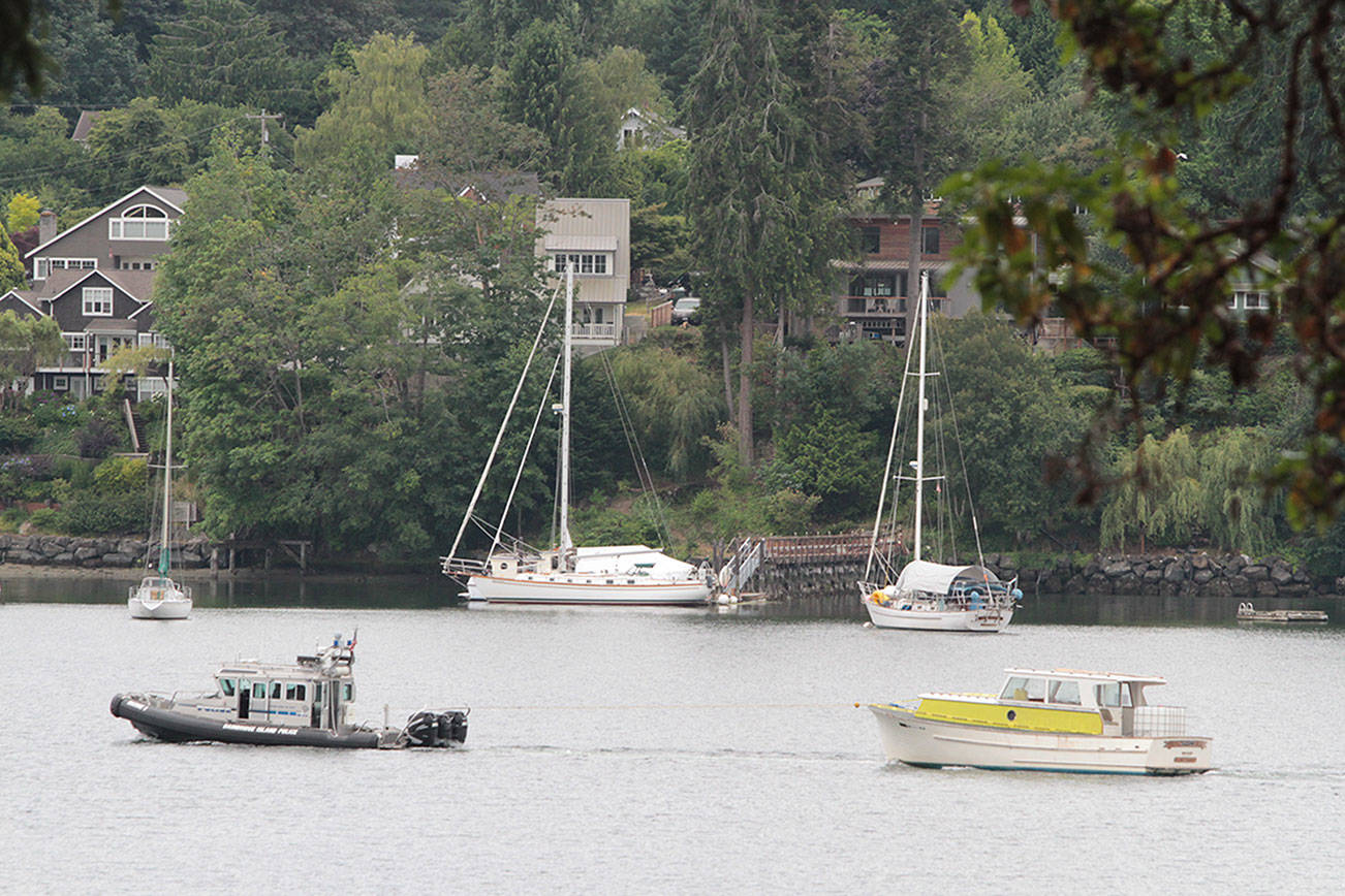Derelict, dangerous boat towed from island waters to Seattle
