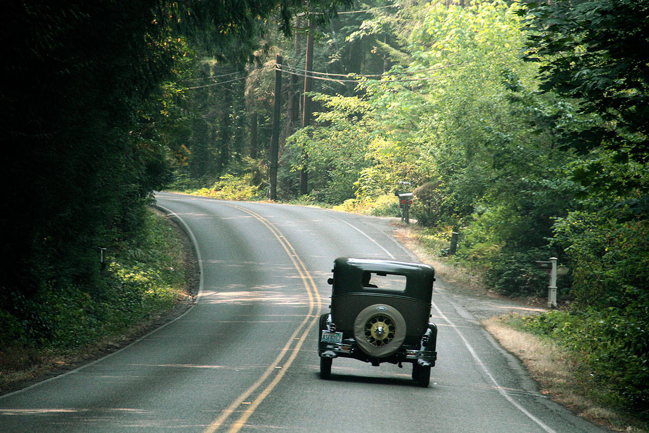 A driver in a Model A Ford drives along Miller Road earlier this week.