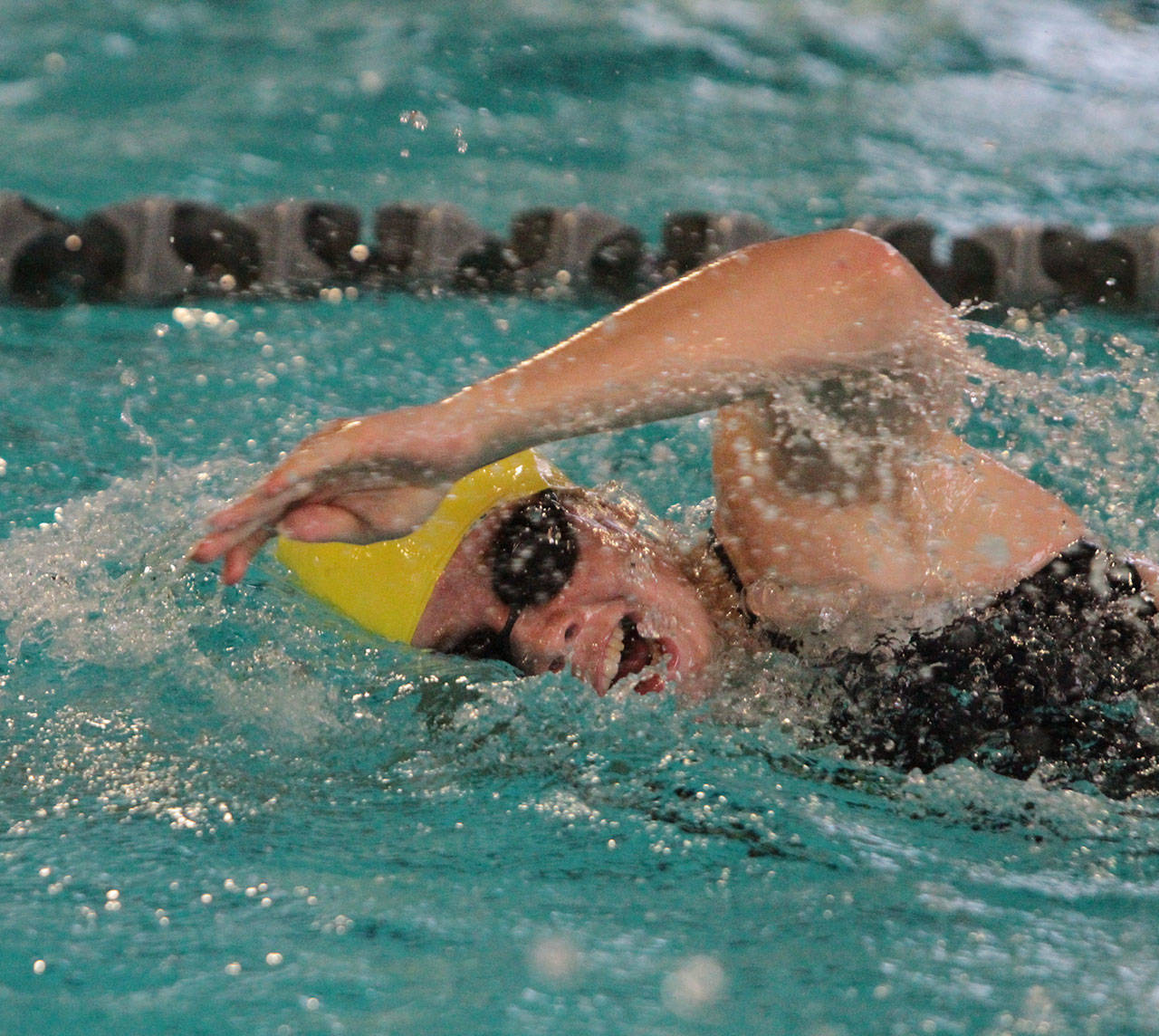 Laura Murphy swims the 100-yard freestyle against Holy Names Academy during HNA’s meet against Bainbridge last week at home. (Brian Kelly | Bainbridge Island Review)