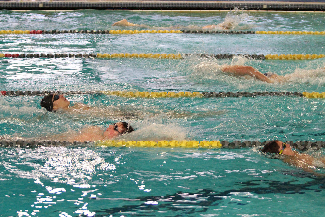 Members of the Spartans’ swim team train during a recent session at the Bainbridge Aquatic Center. (Brian Kelly | Bainbridge Island Review)