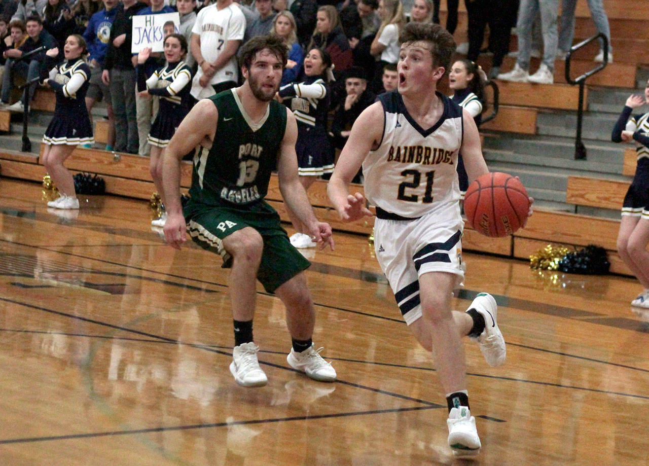Luciano Marano | Bainbridge Island Review - Spartan sophomore Andrew Ward drives toward the hoop during Tuesday’s debut home game.