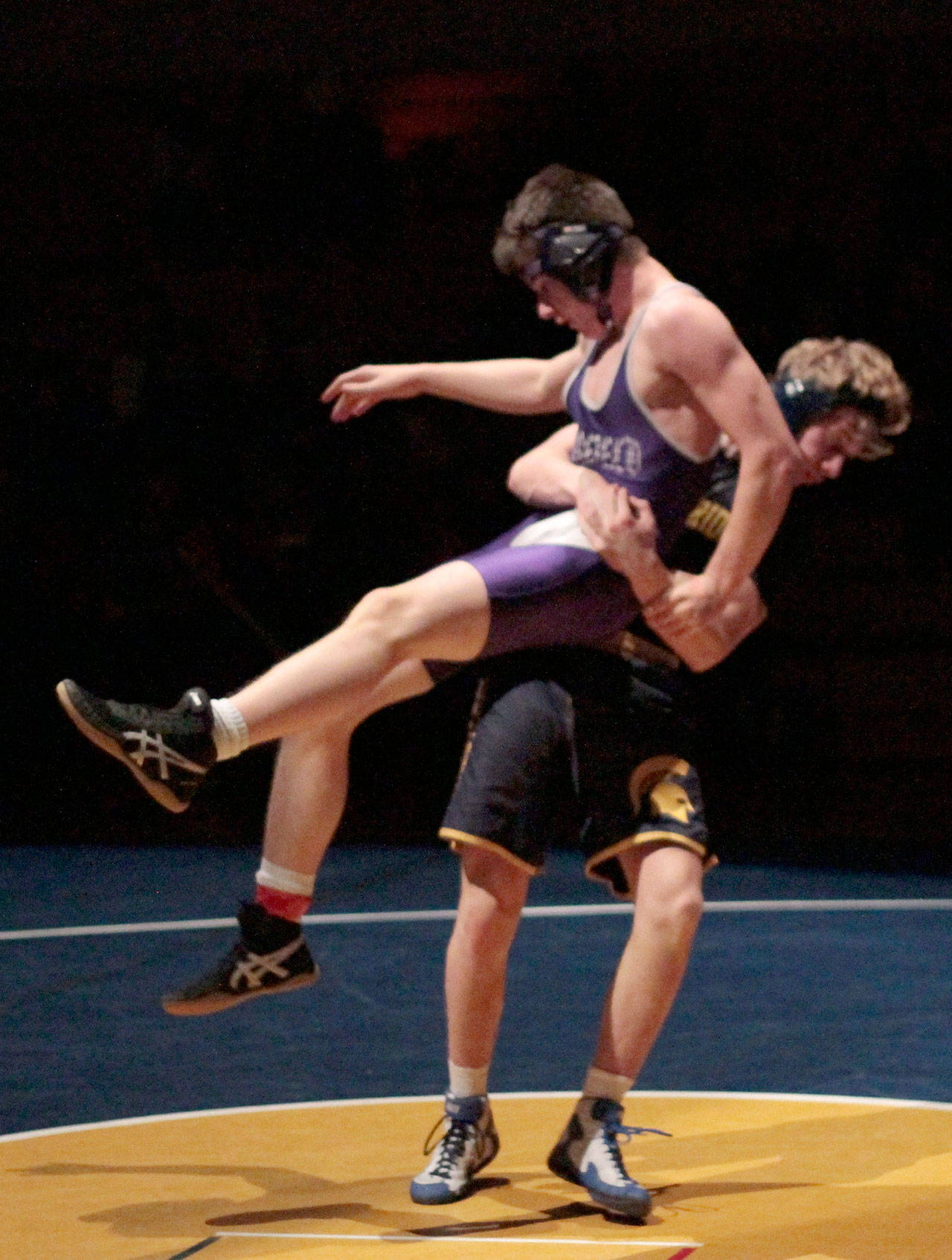 Luciano Marano | Bainbridge Island Review - BHS’ Ben Dunscombe scored a 3-0 decision win against Garfield’s Joseph Demonte in the 160-pound bracket during the first home wrestling match of the year.