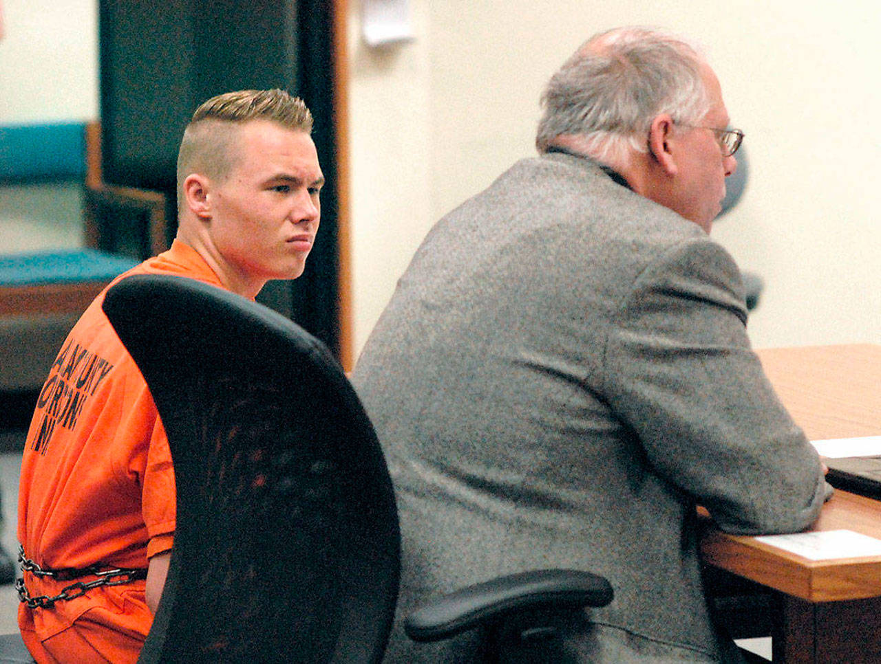 Benjamin Bonner looks at defense attorney Harry Gasnick during Bonner’s first appearance in Clallam County Superior Court last year.                                (Keith Thorpe | Peninsula Daily News)