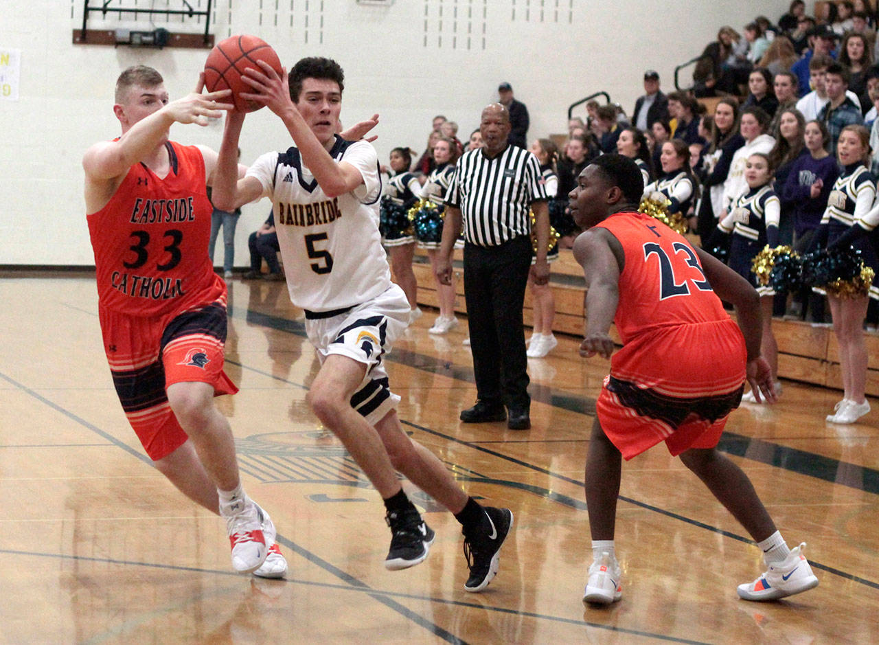 Luciano Marano | Bainbridge Island Review - Spartan junior Deniz O’Rourke looks to make a pass during the final game of the regular season last Friday.