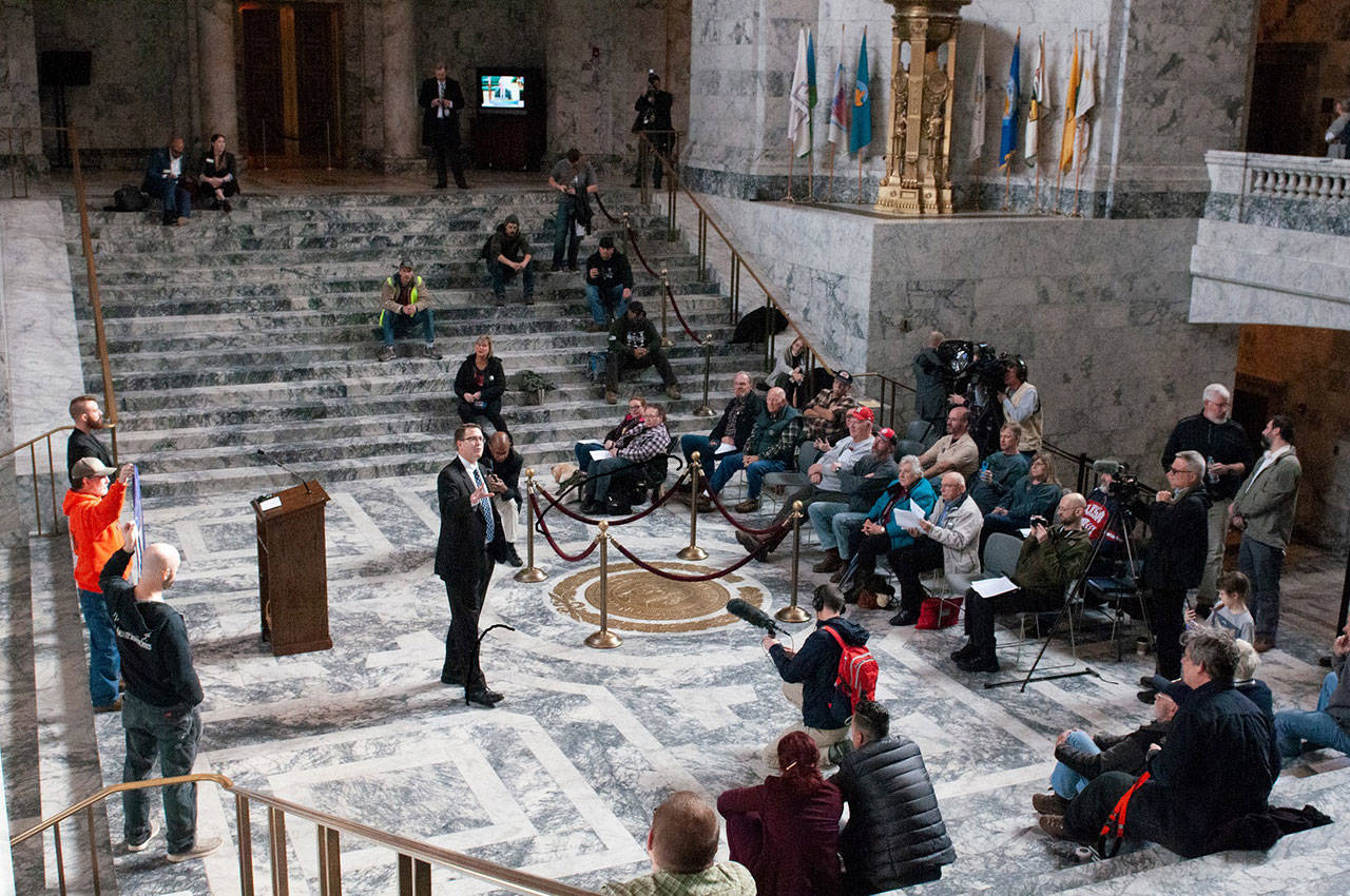 Rep. Matt Shea, R-Spokane addresses about three dozen people who drove from the east side of the Cascades to rally for gun rights and for their own state. Shea proposes legislation to form a 51st state on the east side of Washington. (Photo by Sean Harding, WNPA Olympia News Bureau)
