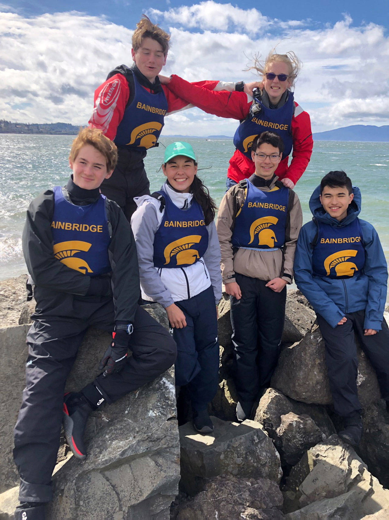 Photo courtesy of David Kaseler | The Bainbridge Sailing team was represented by (front row) Barrett Lhamon, Grace Frei, Evan Yeung, Thomas McNulty and (back row) Trevor Royset and Lindsay Campbell at the recent Bellingham regatta. Also sailing, but not pictured, was Banning Jones.