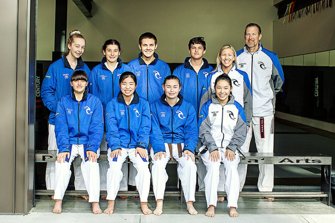 The Pacific Fusion Martial Arts Sports Team gathers for a photo. In the front row is Evelyn Safford, Yuuki Inoue, Sunny Gregson and Coach Lili Aduddell. In the back row is Merida Prentice, Hannah Kress, David Ard, Desi Mortell and Coach Stephanie Aduddell and Coach Ken Aduddell. (Photo courtesy of Pacific Fusion Martial Arts)