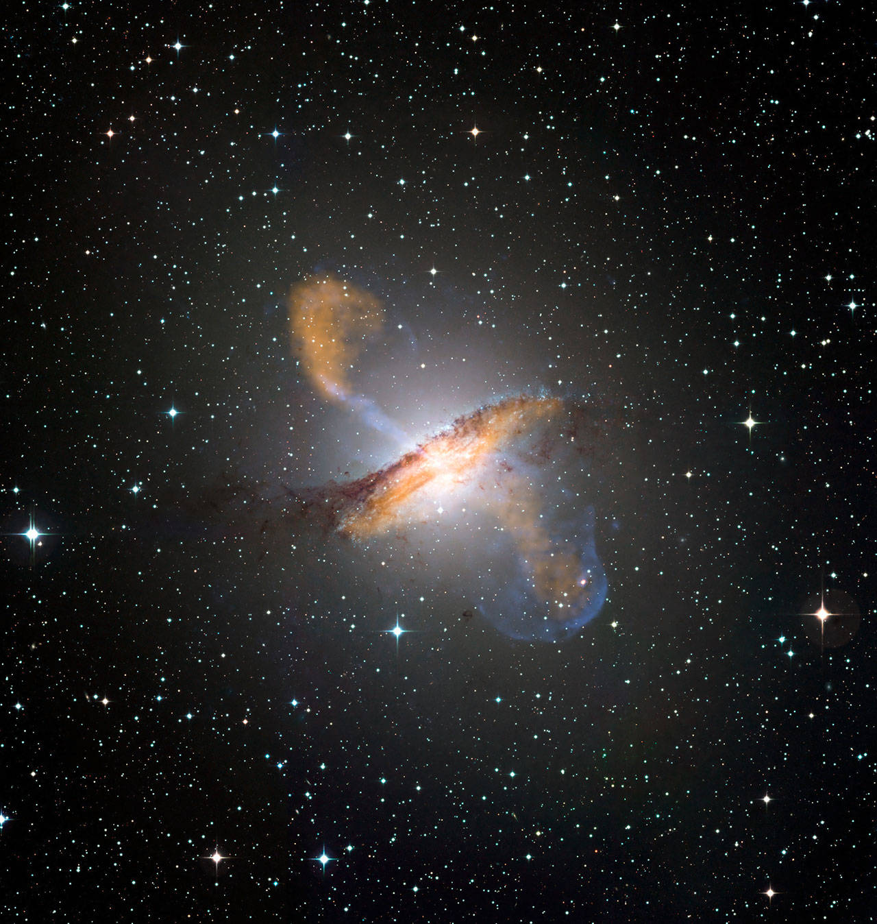An image of Centaurus A, revealing the lobes and jets emanating from the active galaxy’s central black hole. (Photo courtesy of ESO/NASA)