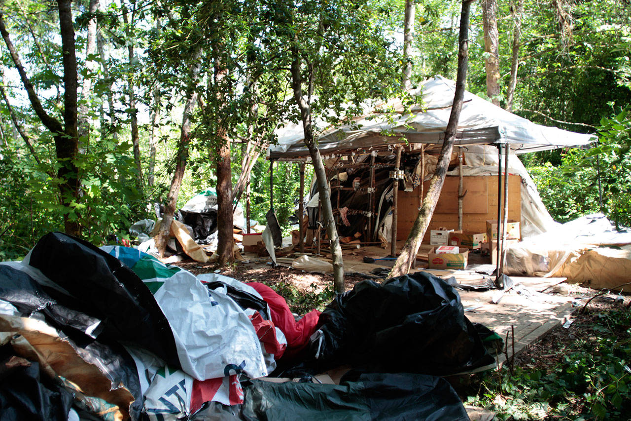 Luciano Marano | Bainbridge Island Review - The remains of the illegal homeless camp near the Highway 305 and High School Road intersection as it stood Wednesday. The encampment was set to be cleared away in the following days, the two residents having been assigned permanent housing elsewhere.