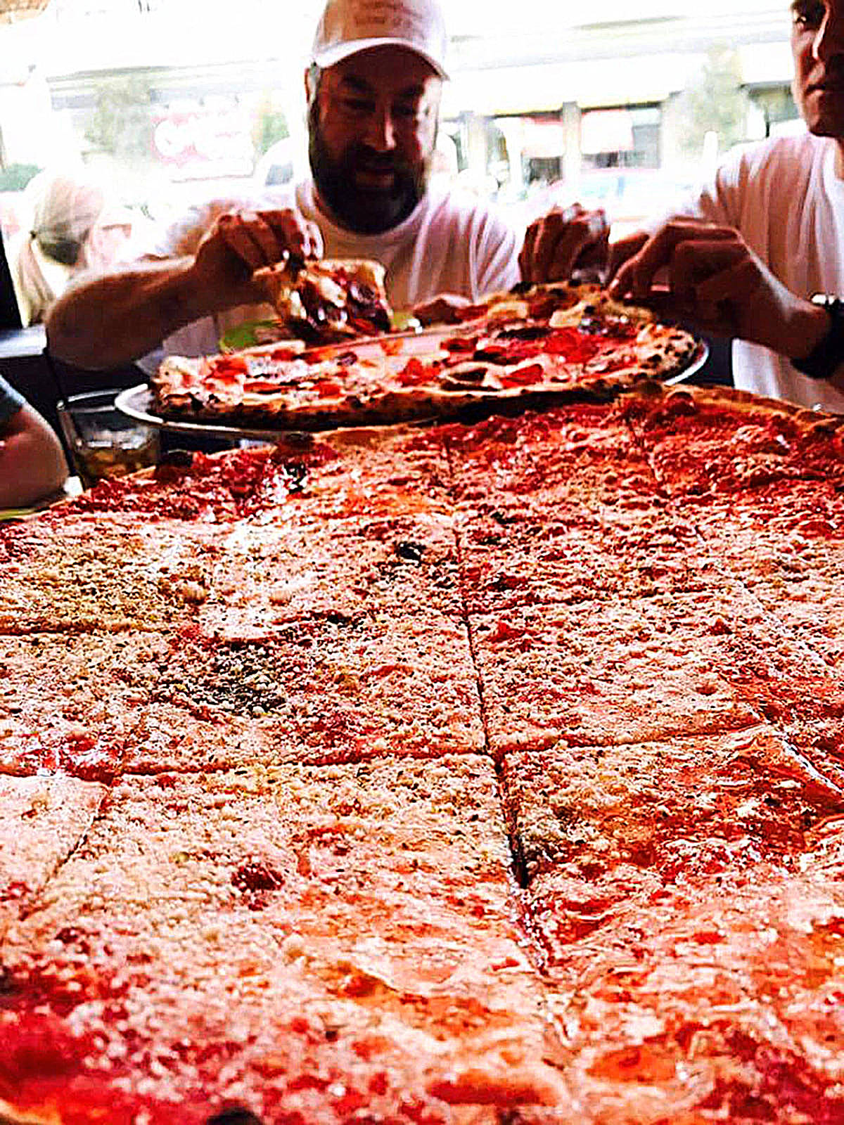 Photo courtesy of Will Grant | That’s A Some Pizza’s owner Will Grant does some tasty research during a trip to a prestigious pizza college in San Francisco in 2017. Earlier this year he competed at the World Pizza Championships in Parma, Italy, placing third for Americans overall (and the only high-ranked chef from the Pacific Northwest) in the Duo Competition, where he teamed up with Houston, Texas-based pizza master Nicole Bean.                                 Photo courtesy of Will Grant | That’s A Some Pizza’s owner Will Grant does some tasty research during a trip to a prestigious pizza college in San Francisco in 2017. Earlier this year he competed at the World Pizza Championships in Parma, Italy, placing third for Americans overall (and the only high-ranked chef from the Pacific Northwest) in the Duo Competition, where he teamed up with Houston, Texas-based pizza master Nicole Bean.