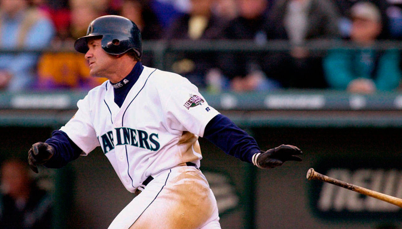 The Mariners’ Edgar Martinez drops his bat as he heads toward first on a two-run double against the Athletics on April 4, 2001, in Seattle. (AP Photo | Elaine Thompson)