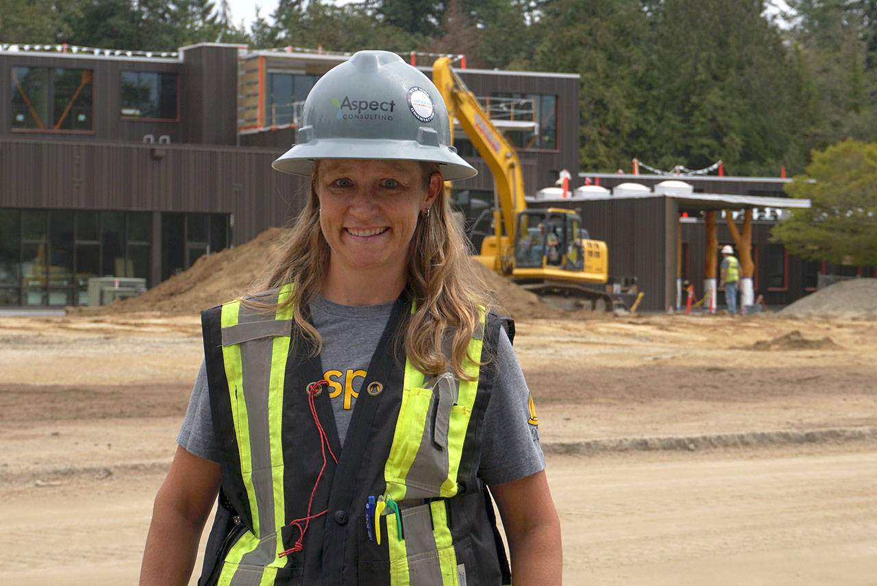 Luciano Marano | Bainbridge Island Review - Alison “Ali” Dennison, senior engineering geologist for Aspect Consulting, one of the companies behind the new Captain Johnston Blakely Elementary School, and mother of two Blakely students, stands before the new, in-progress facility.