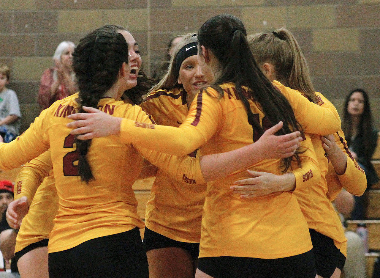 The Buccaneers huddle up during a timeout late in set three just before defeating Bainbridge in their opening match. (Mark Krulish | Kitsap News Group)