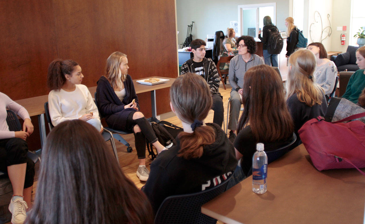 Students in the Lead From Within group meet with BYS executive director Cezanne Allen during a meeting Monday in BYS’s new facility across from the Bainbridge Island Aquatic Center. (Luciano Marano | Bainbridge Island Review)