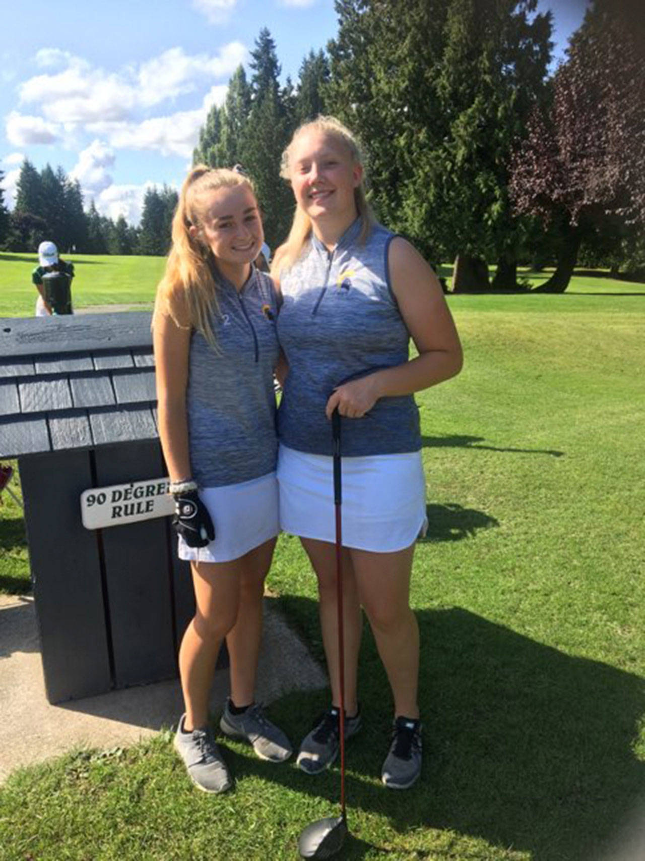 Sara Havill photo | Bainbridge High School varsity girls golf team co-captains, senior Kendall Havill and junior Anna Kozlosky, pose for a photo after at Meadowmeer Golf & Country Club on Sept. 18, where the Spartans bested Roosevelt 101-90.