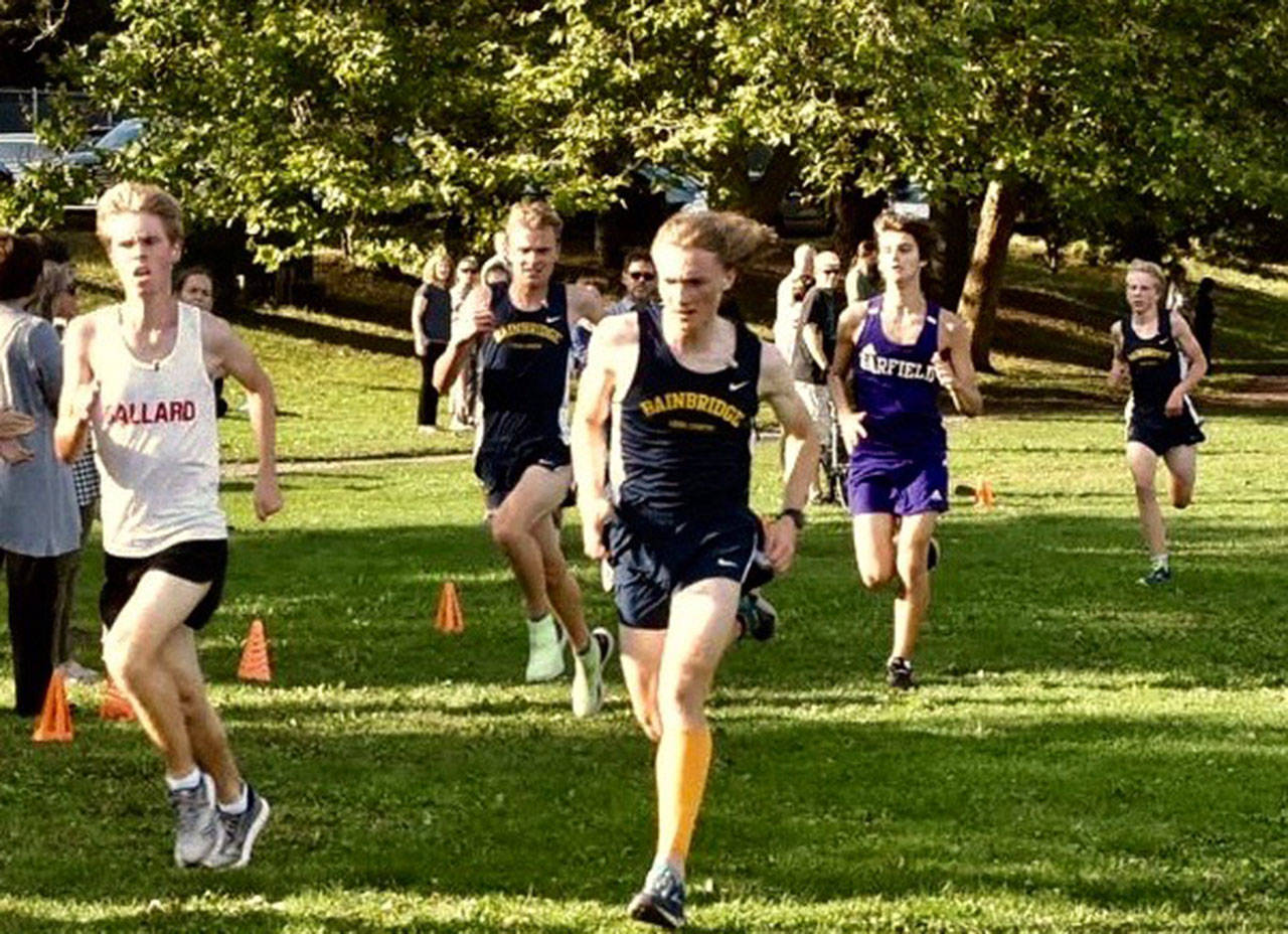 Steven Albergine photo | Bainbridge High School cross country runners (left to right) freshman Will Browning, senior Reuben Allen and sophomore Mace Korytko at the team’s first league meet at Woodland Park in Seattle.