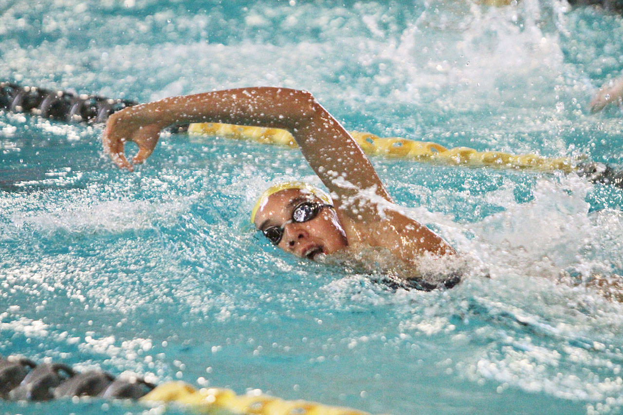 Annalisia Tuinukaufe swims the third leg in the 800-yard freestyle relay during the Spartan Relays. The Spartans are off to a strong start this year, with nine swimmers already qualified for the state championships in November. (Brian Kelly | Bainbridge Island Review)