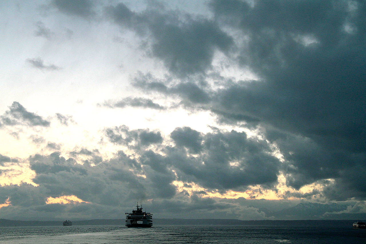 A ferry departs Colman Dock in Seattle for Bainbridge Island. (Brian Kelly | Bainbridge Island Review)