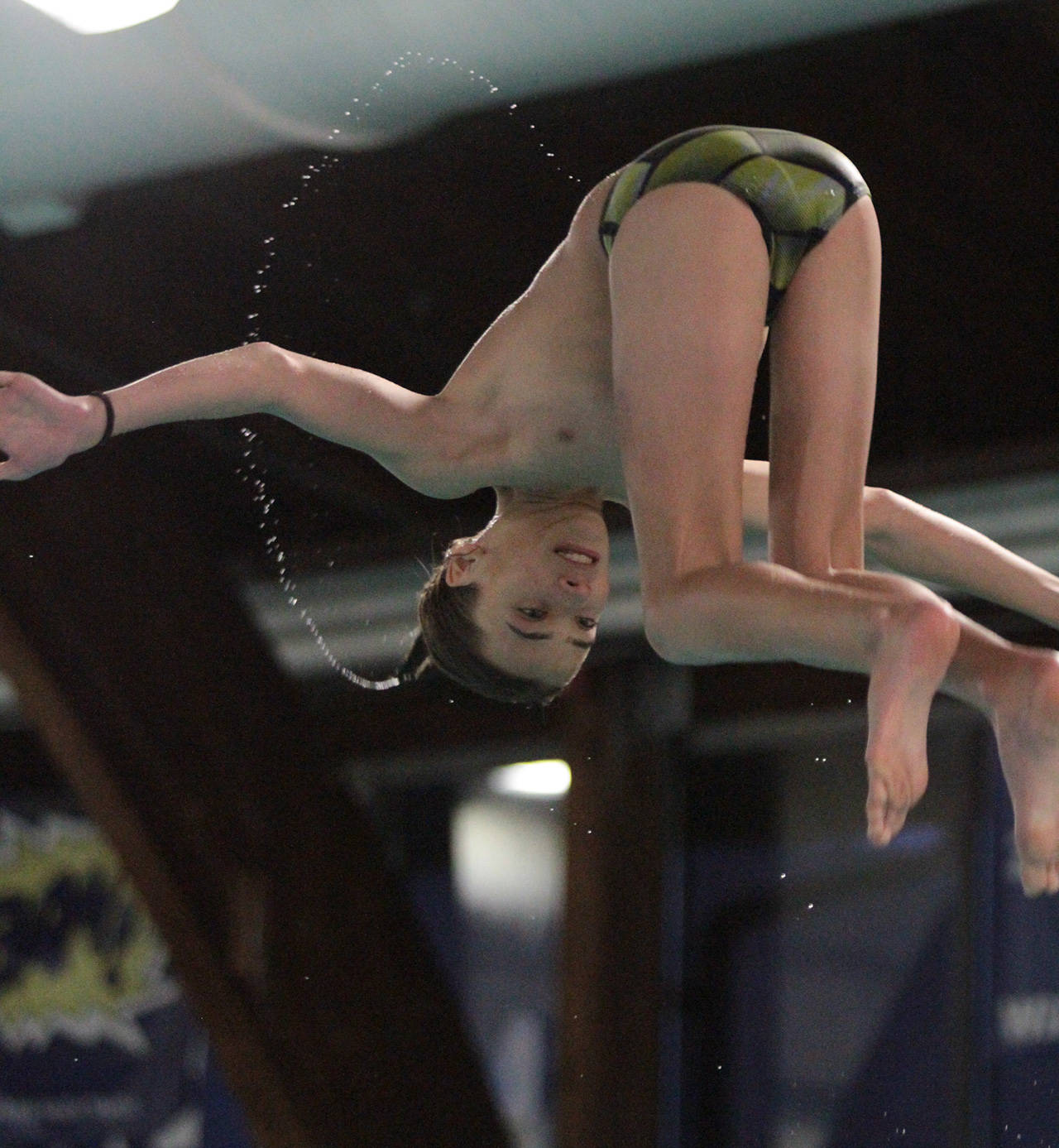 Carter Ragan competes in 1-meter diving for the Spartans in their matchup against Lakeside. (Brian Kelly | Bainbridge Island Review)