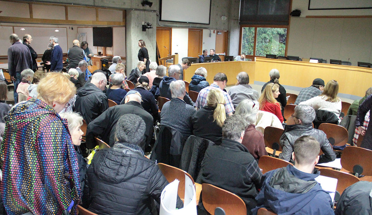 A large crowd crams into council chambers before the start of Thursday’s public hearing on the Winslow Hotel. (Brian Kelly | Bainbridge Island Review)